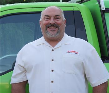 Photo of Steve in front of decaled SERVPRO Service Van