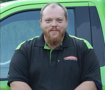 Photo of Shawn in front of decaled SERVPRO Service Van