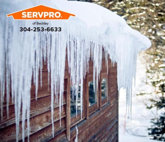 Ice dams and icicles are visible on a roof.