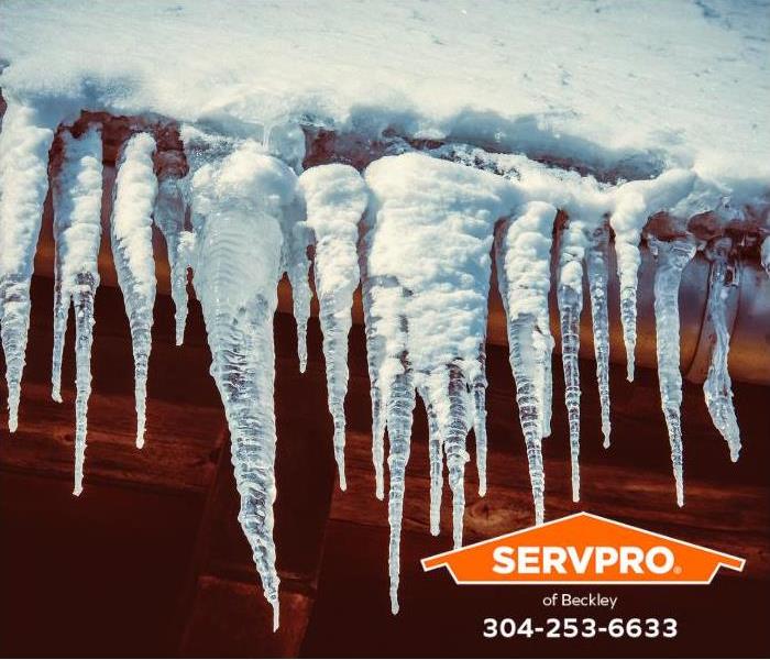 Ice dams and icicles form on the edge of a roof.