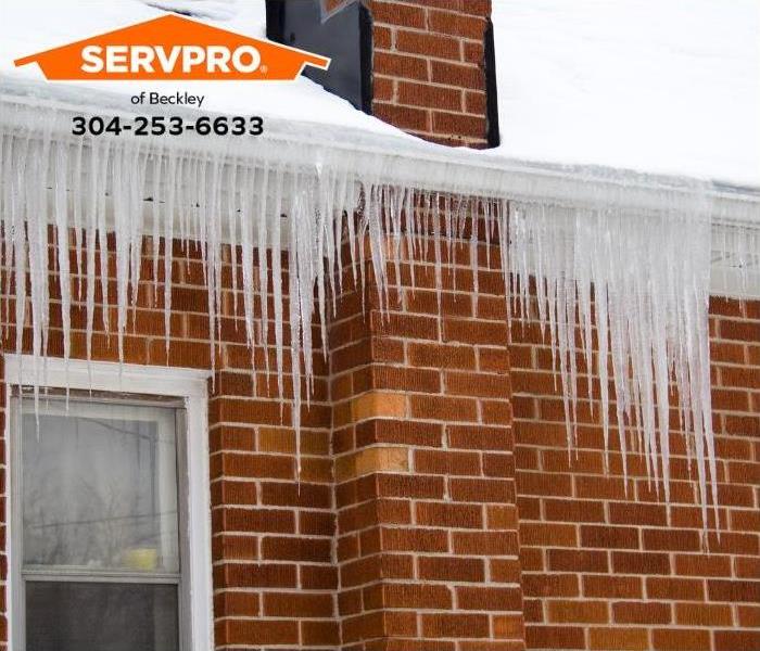 An ice dam prevents water from draining properly off a roof.