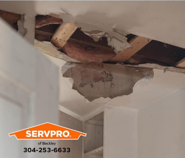 A water leak and water damage in a ceiling are shown.