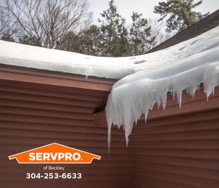 An ice dam has formed on a roof.